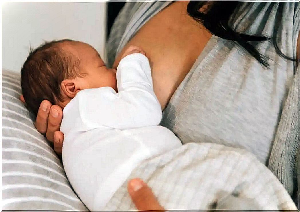 Mother breastfeeding her baby.