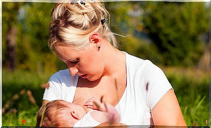 mother breastfeeding her baby as breastfeeding could prevent breast cancer