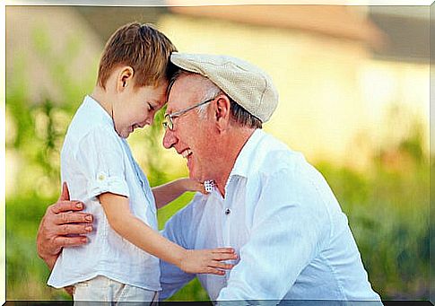 Grandfather with grandson smiling