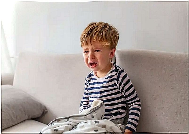 A child crying because he is afraid of everything.