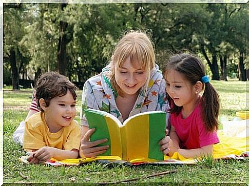 Mother reading children's stories to children