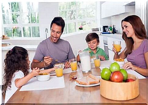 Family having breakfast so as not to go to school fasting